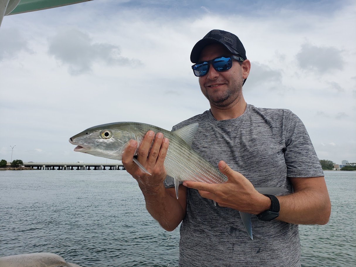 Miami bonefishing charter with Florida Native Charters – angler holding bonefish on Biscayne Bay